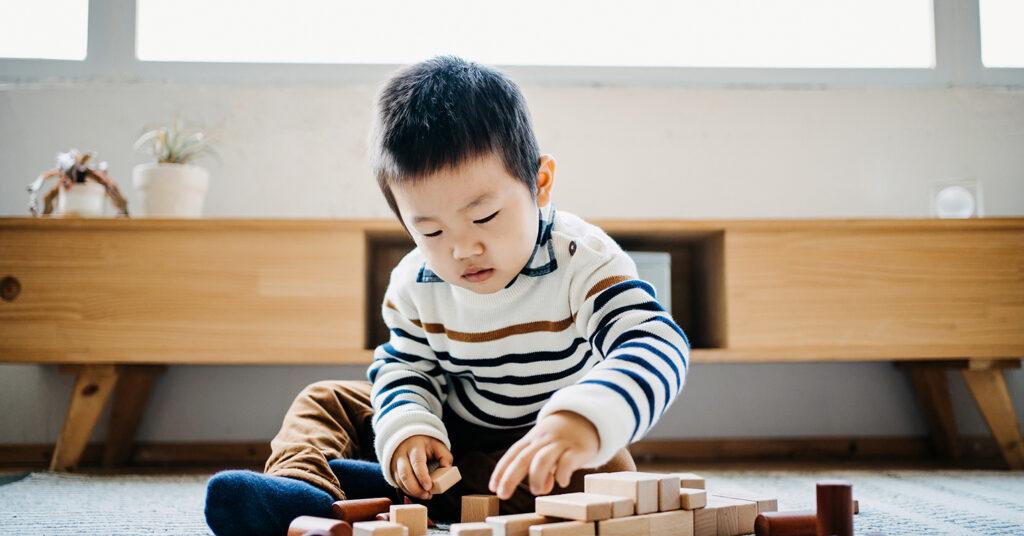 A child playing with building blocks.